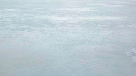 aerial sideways, close up of snow covered ice, title background