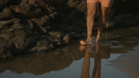 man walking on the beach