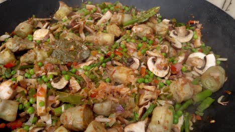 assortment of vegetables cooking in pan