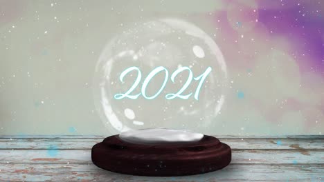 Blue-shooting-star-around-happy-holidays-text-over-a-snow-globe-on-wooden-plank