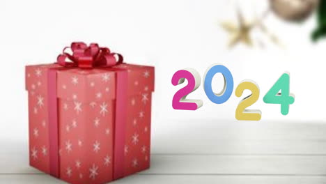 animación de texto de 2024 y regalos de navidad y decoraciones en el fondo.