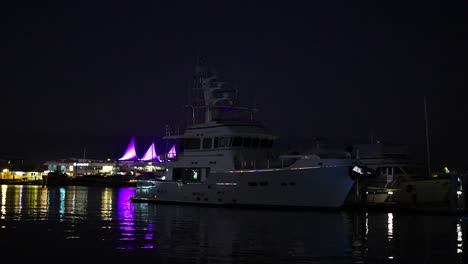 illuminated yachts and harbor lights at night