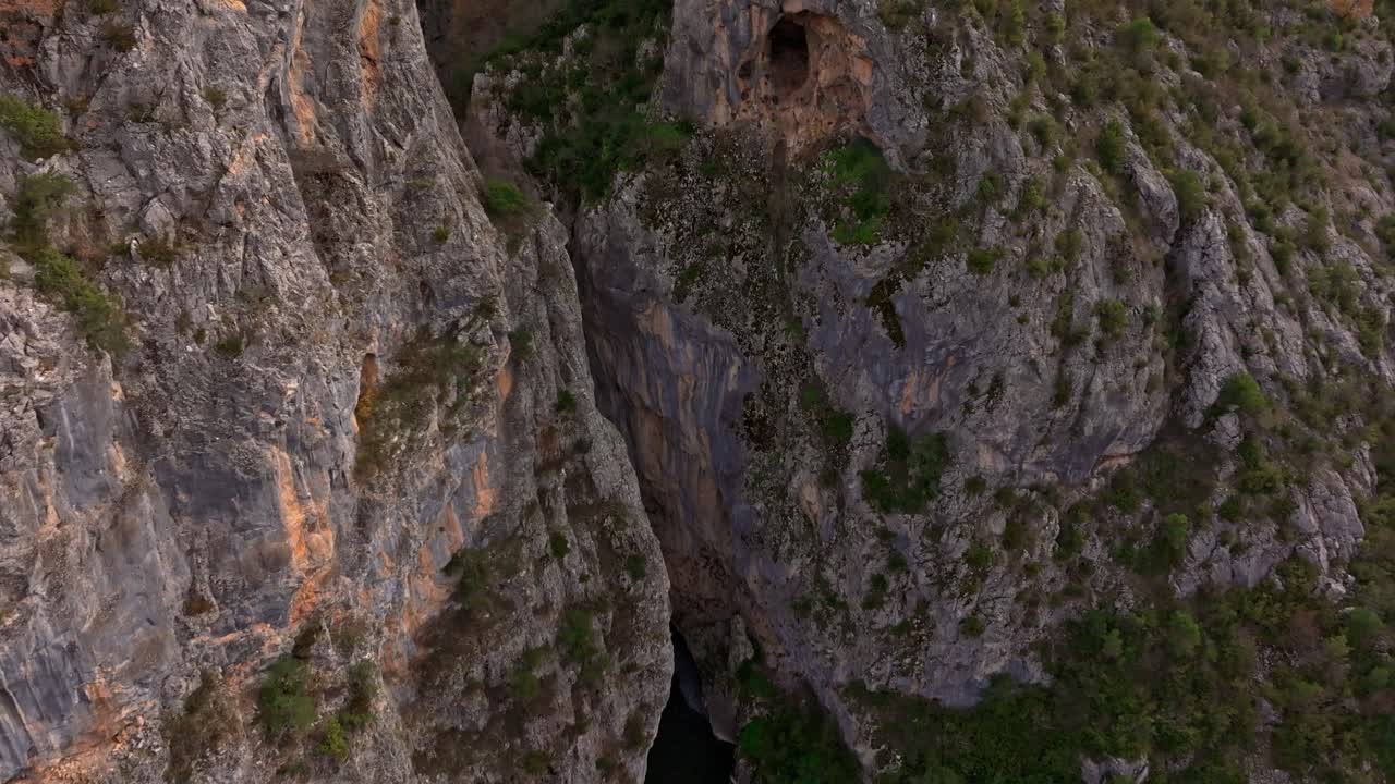 Drone image of historic Portitsa bridge in calm gorge, Spileo, Greece