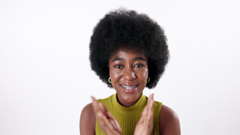 woman with afro blowing a kiss