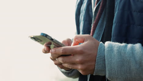 Hands,-phone-and-typing-outdoor-for-communication