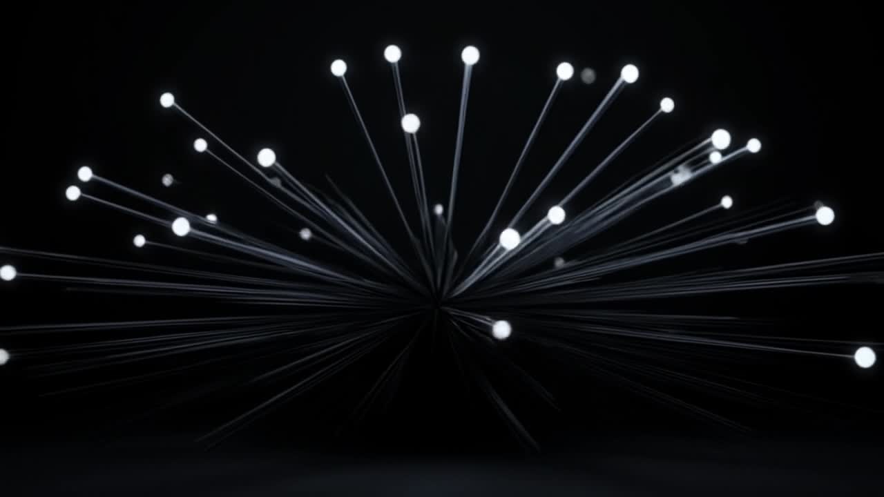 Illuminated particles in a dark space. Light points radiate outward from a central point, creating a mesmerizing visual effect in a dark environment.