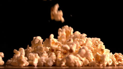popcorn pouring on black background