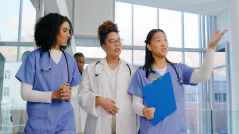 doctors, team and women in hospital hallway