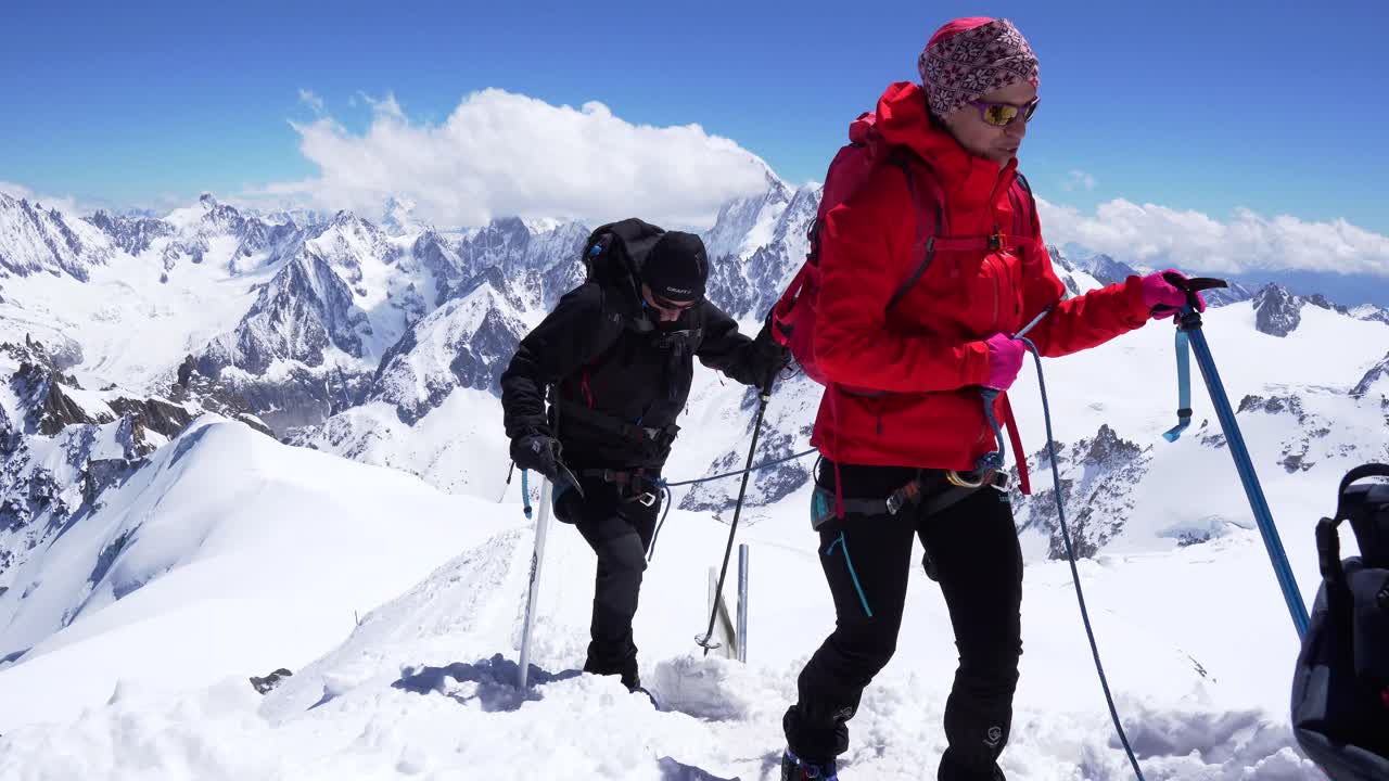 AIGUILLE DU MIDI CHAMONIX MONT BLANC, FRANCE on JUNE 2019. hiking group in snowy mountains