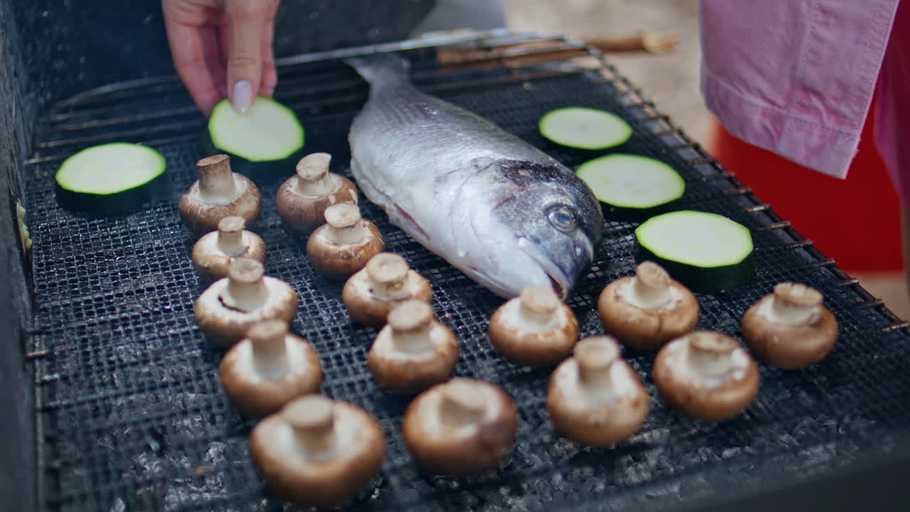 Closeup food grilling coals at nature picnic. Fresh food preparing at barbeque
