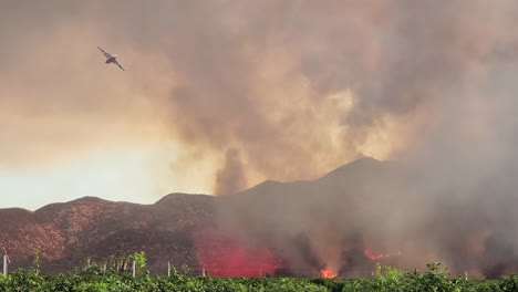 heavy planes extinguishing wildfires of california, view from ground