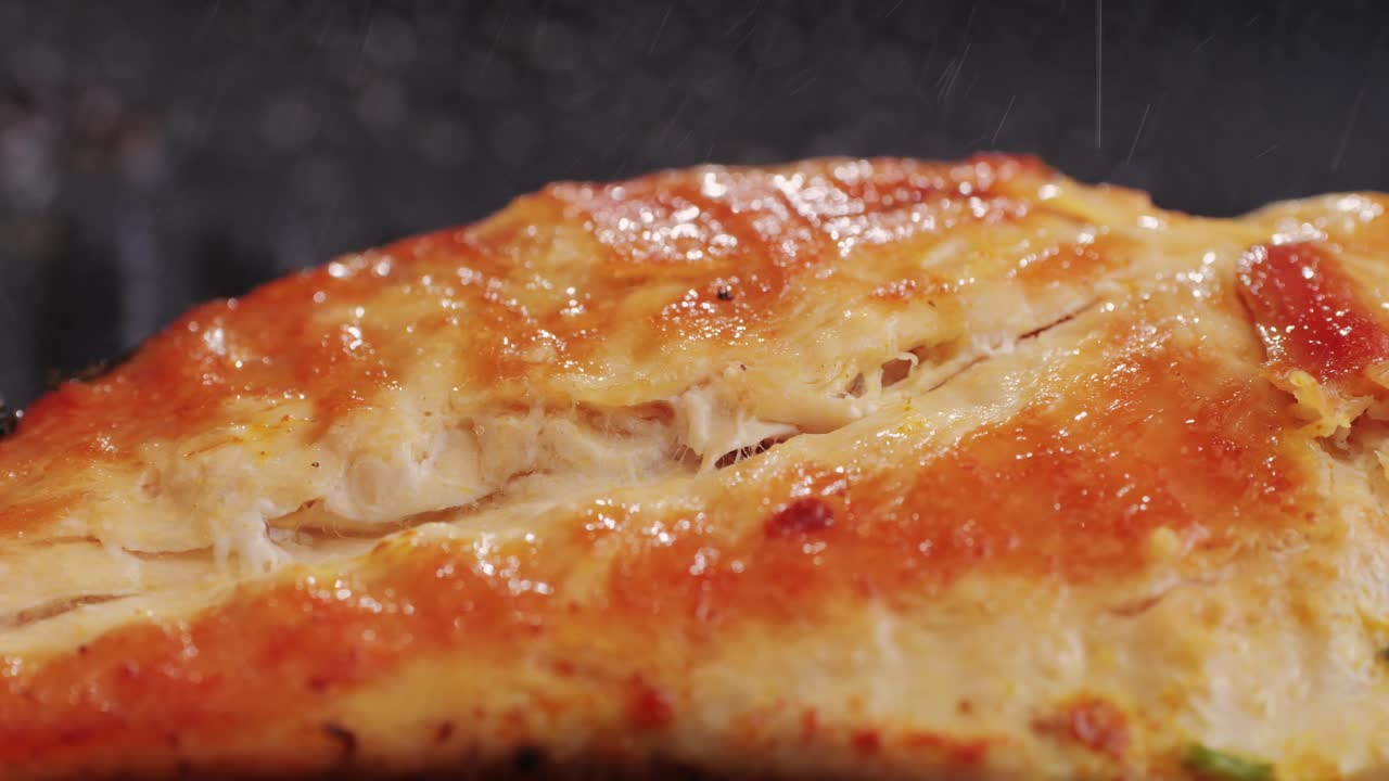 Cooking raw chicken meat in yellow turmeric spice with garlic and greens on grill close-up. Fry chicken slice on frying.pan Grilled chicken, duck, turkey kebab with vegetables.