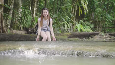 tourist woman relaxing in the river, slow motion