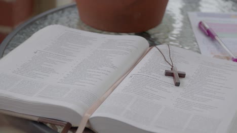 a young girl reading the bible, side profile, tilt down shot