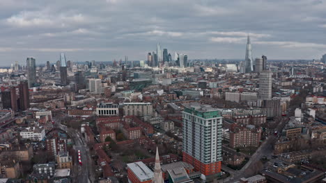 drone shot towards city of london skyscrapers shard over north lambeth southwark