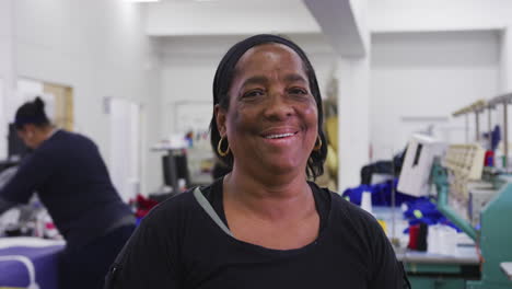 Front-view-of-mixed-race-woman-in-factory