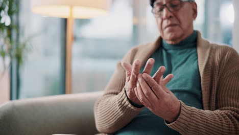 senior man experiencing hand pain