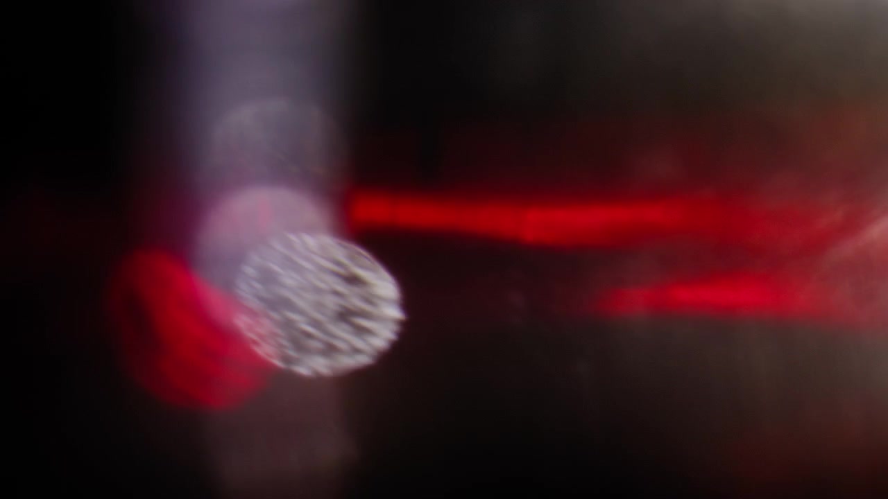 Trendy romantic red liquid in abstract motion on a black background