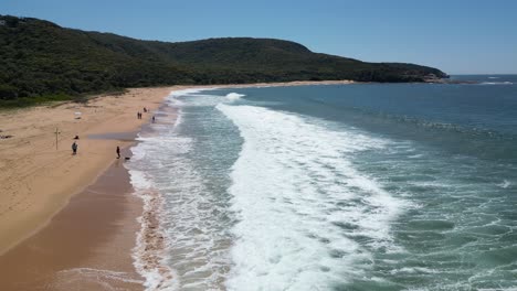 Fly-over-crushing-waves-at-Bouddi-Nationalpark,-Putty-Beach-Australia