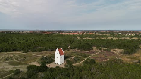 Aerial-Orbit-of-Den-Tilsandede-Church,-Skagen,-Denmark