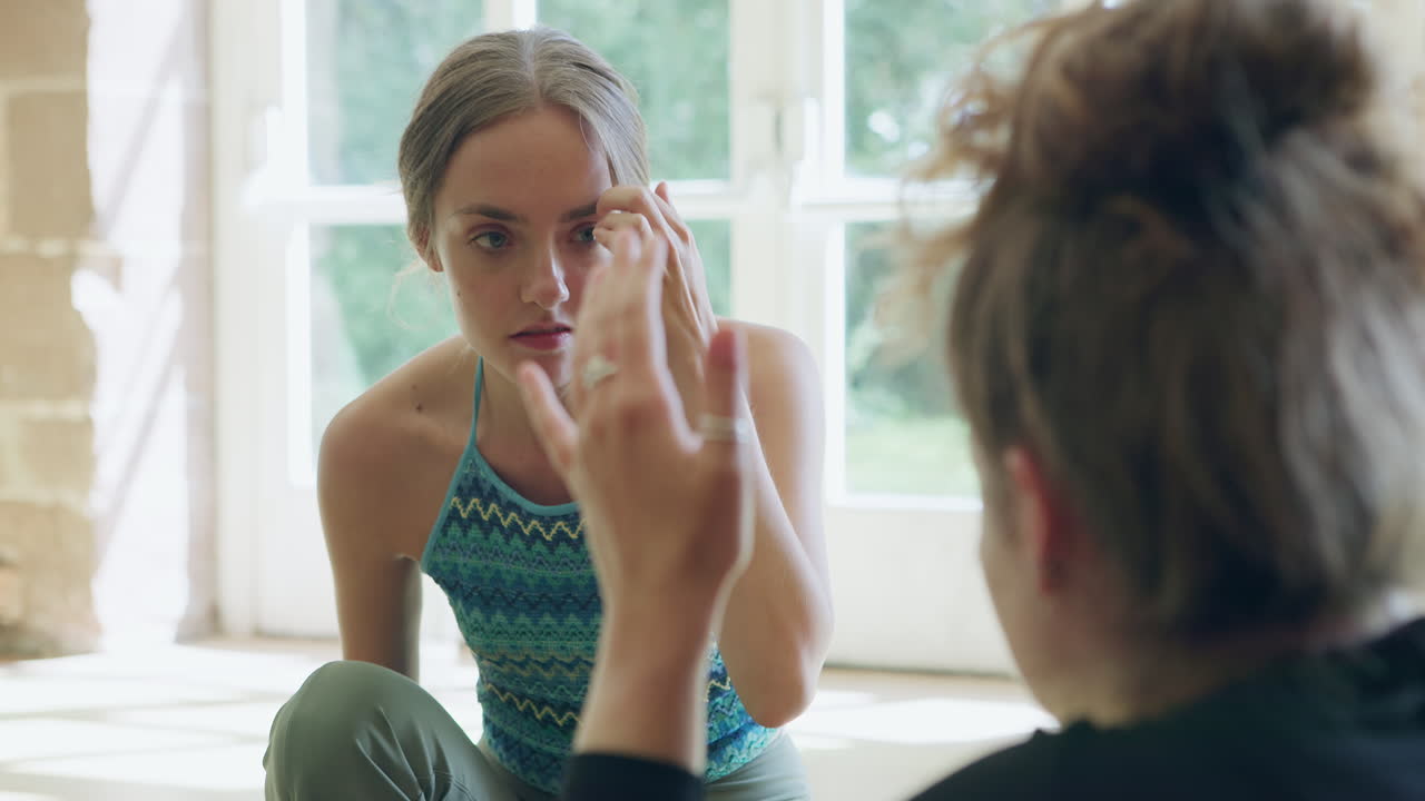 Two women having a conversation indoors