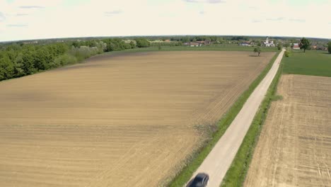 Cinematic-footage-of-the-car-driving-down-the-road