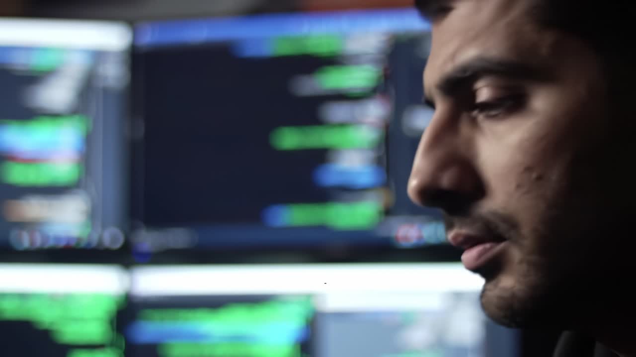 A Focused Individual Analyzing Data on Multiple Monitors, Engaged in Tech Activities Surrounded by Streams of Information and Complex Algorithms