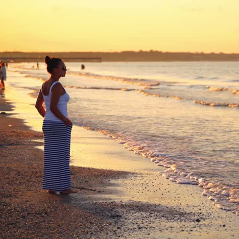 woman looking at view on beach