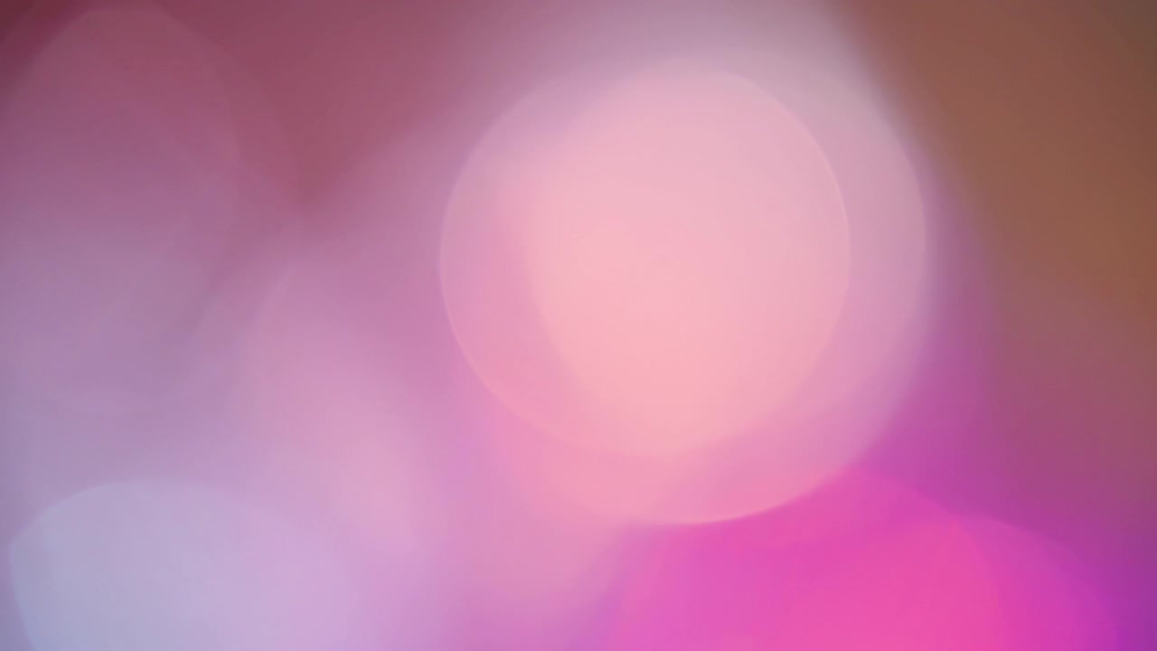 Light leak vibranti e bokeh in transizione su sfondo nero