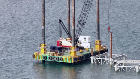 aerial telephoto shot around a offshore natural gas pumping station on the caribbean sea