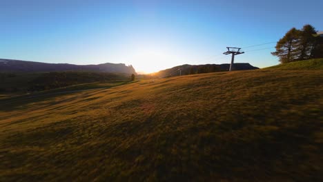 Mountains,-forest-and-fields-filmed-at-Alpe-di-Siusi-in-European-Alps,-Italian-Dolomites-filmed-in-vibrant-colors-at-sunset