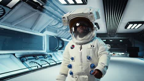 vertical video scientist wearing helmet walking in cutting edge spaceship, doing cosmic voyage