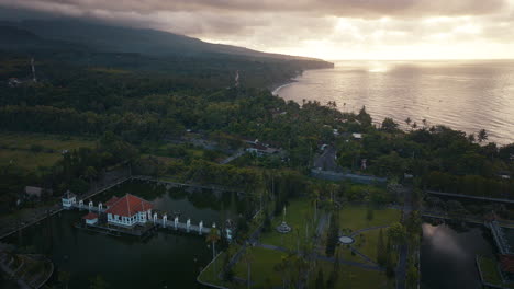 Ujung-Water-Palace-with-sea-and-coast-in-background-at-sunrise,-Karangasem-Regency,-Bali-in-Indonesia