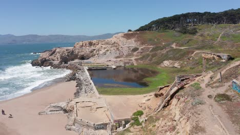 Close-up-descending-and-panning-aerial-shot-of-the-ruins-of-the-Sutro-Baths-at-Land's-End-in-San-Francisco