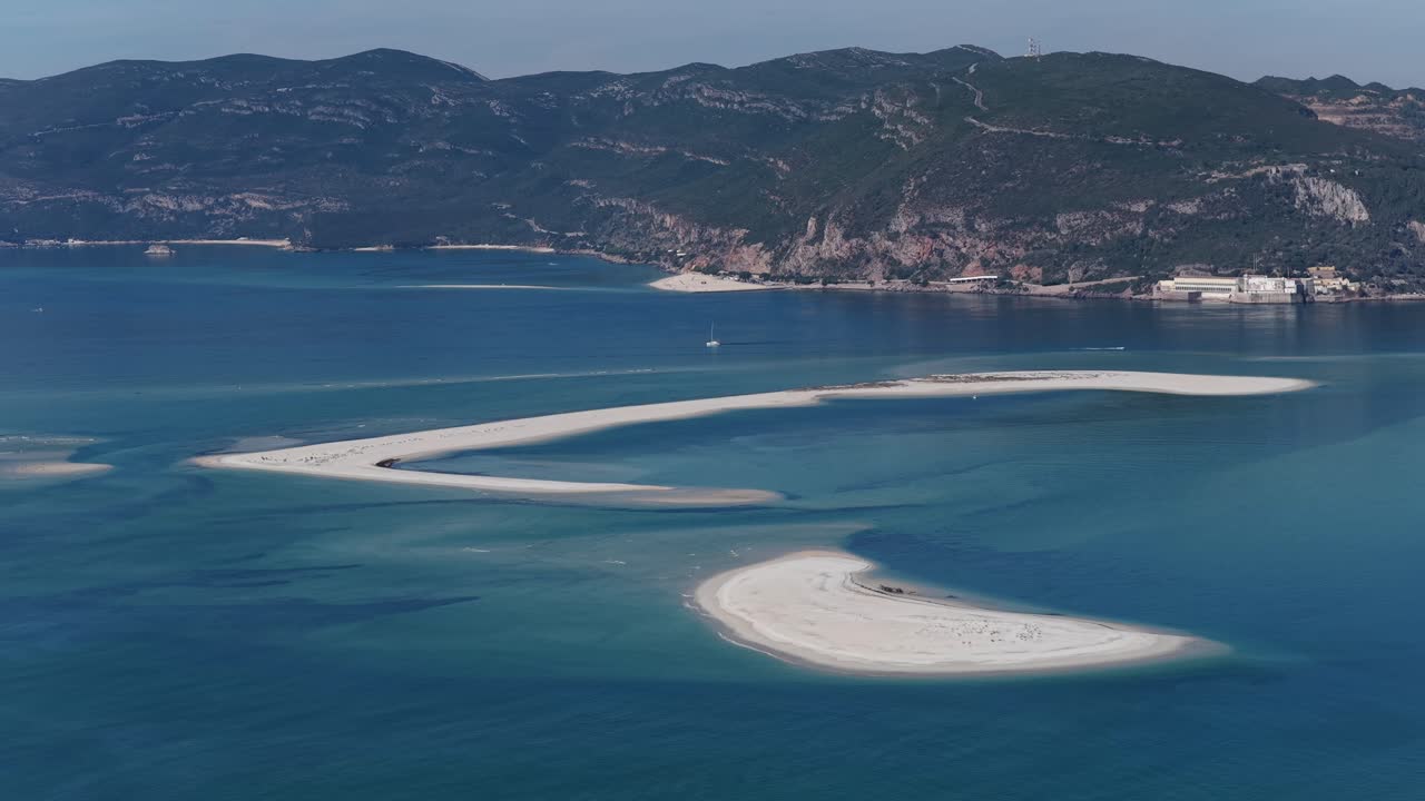 Blue turquoise ocean colors and sand banks on the coastline