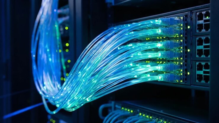 Close-up of Illuminated Network Cables in Data Center