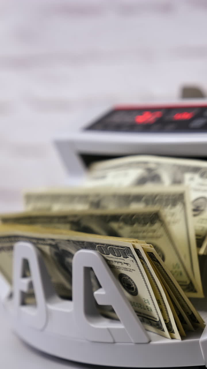 Counting machine for USD dollar paper banknote. Banknote counter. Vertical video