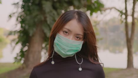 woman wearing a mask in a park