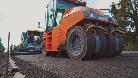 road roller working with asphalt city roads. road roller carried repair works on city streets