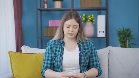 Young-woman-covering-her-mouth-and-nose-while-coughing.