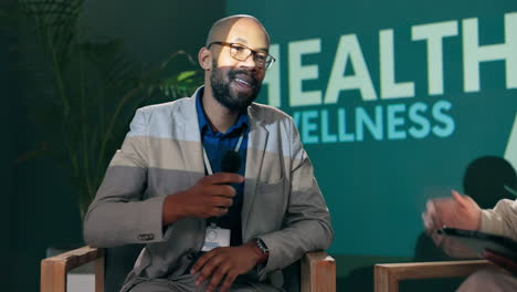 man giving a presentation on health and wellness at a business conference