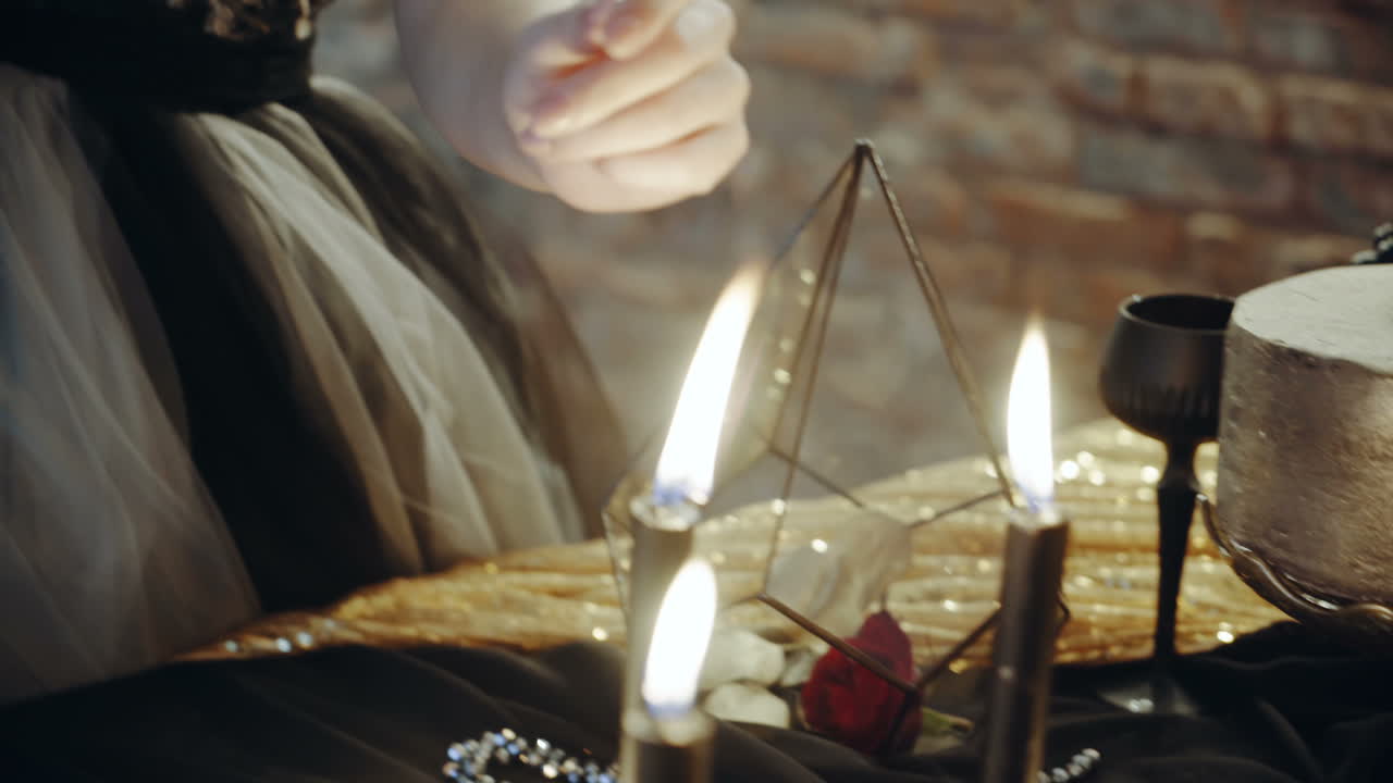 Woman with candles divination magic. Witch woman with candle looking into the future