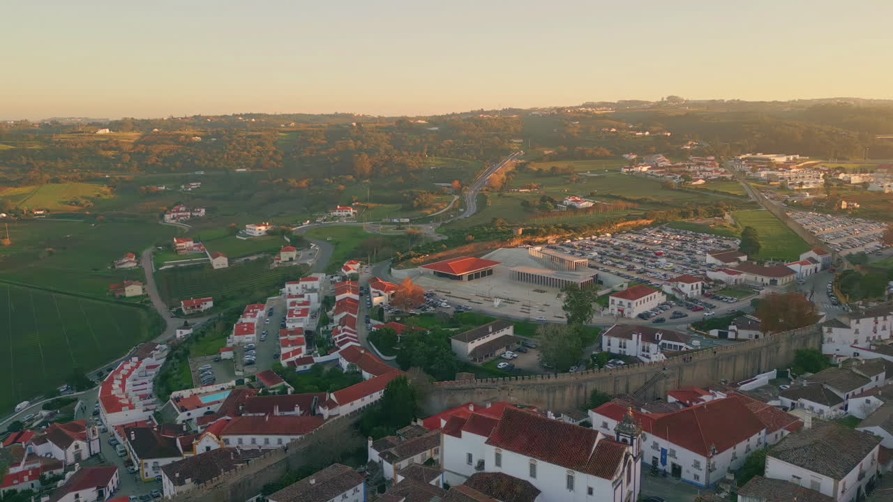 Aerial view suburban neighborhood nestled in countryside. Scenic landscape