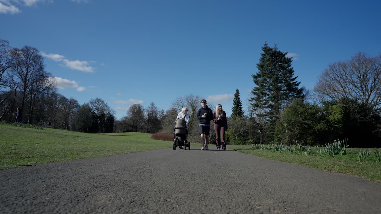 Slow motion leisure walk, baby stroller, loving parental newborn care