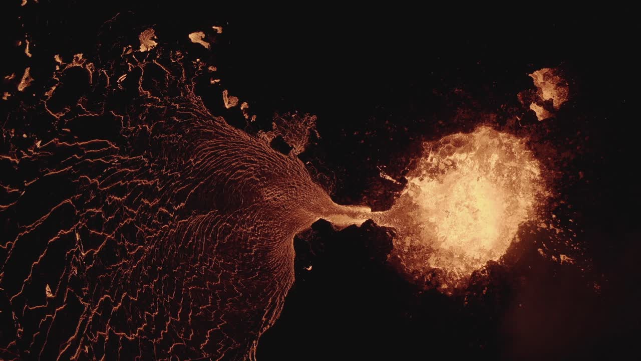 A volcano in Iceland spewing out lava at night