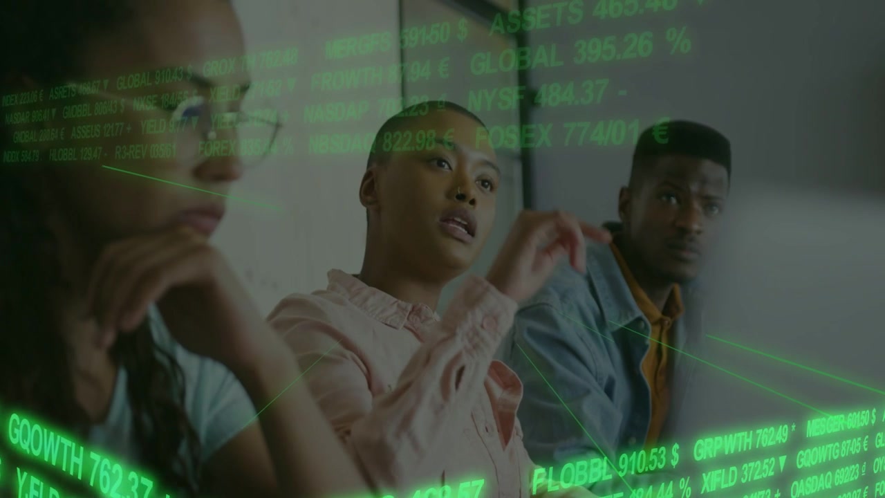 Pointing central woman in pink blouse gesturing at green data overlay in meeting room, glasses