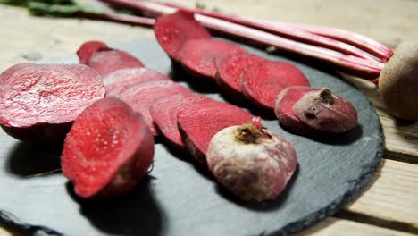 Sliced-beetroot-arranged-on-concrete-board-4k