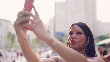 woman taking selfies with a smartphone in an urban setting