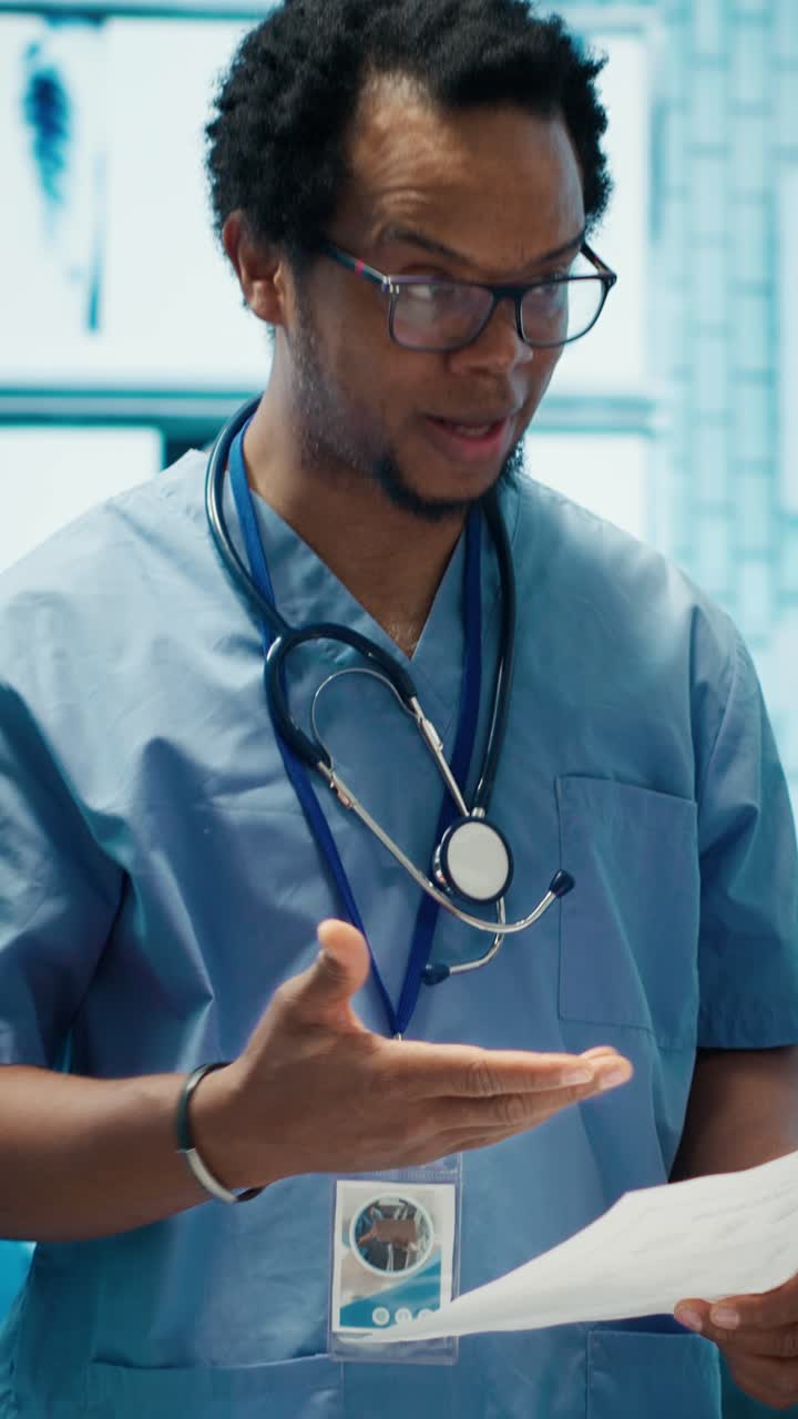 Vertical Video Expert assistant discussing hospital records with specialists team in a meeting