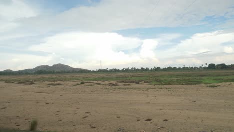 a wide stretch of sacred falgu river dry waterbed with a long stretch of sand dunes, bodhgaya, bihar, india